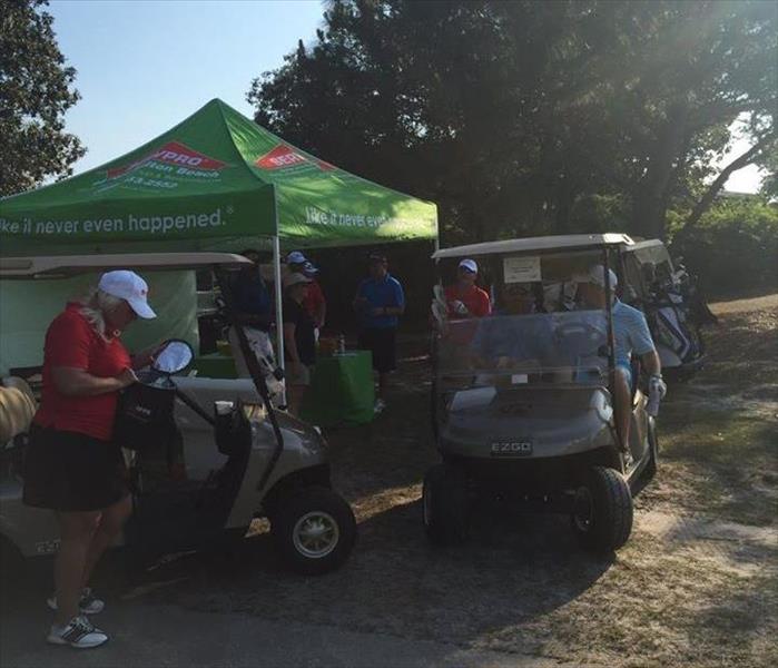 SERVPRO Tent and Surrounding Golf Carts