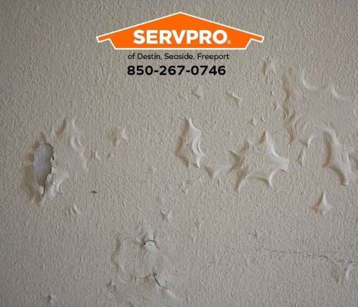 Paint bubbling on a wall indicates water damage.